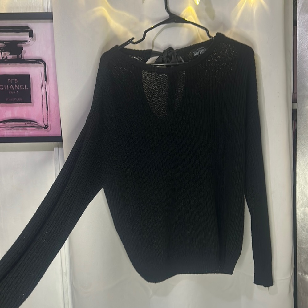A back hole and bow in black with slightly shoulder off.